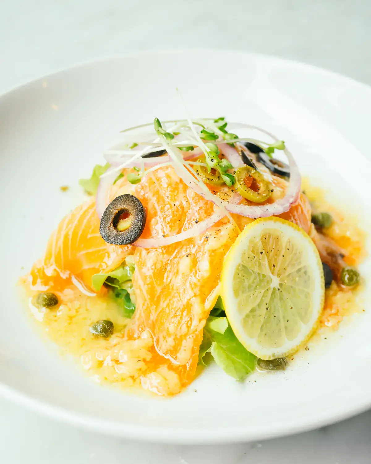 Placeholder image of a fish dish with citrus fruits